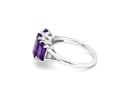 Amethyst center stone ring with sparkling white zircon accents set in elegant sterling silver